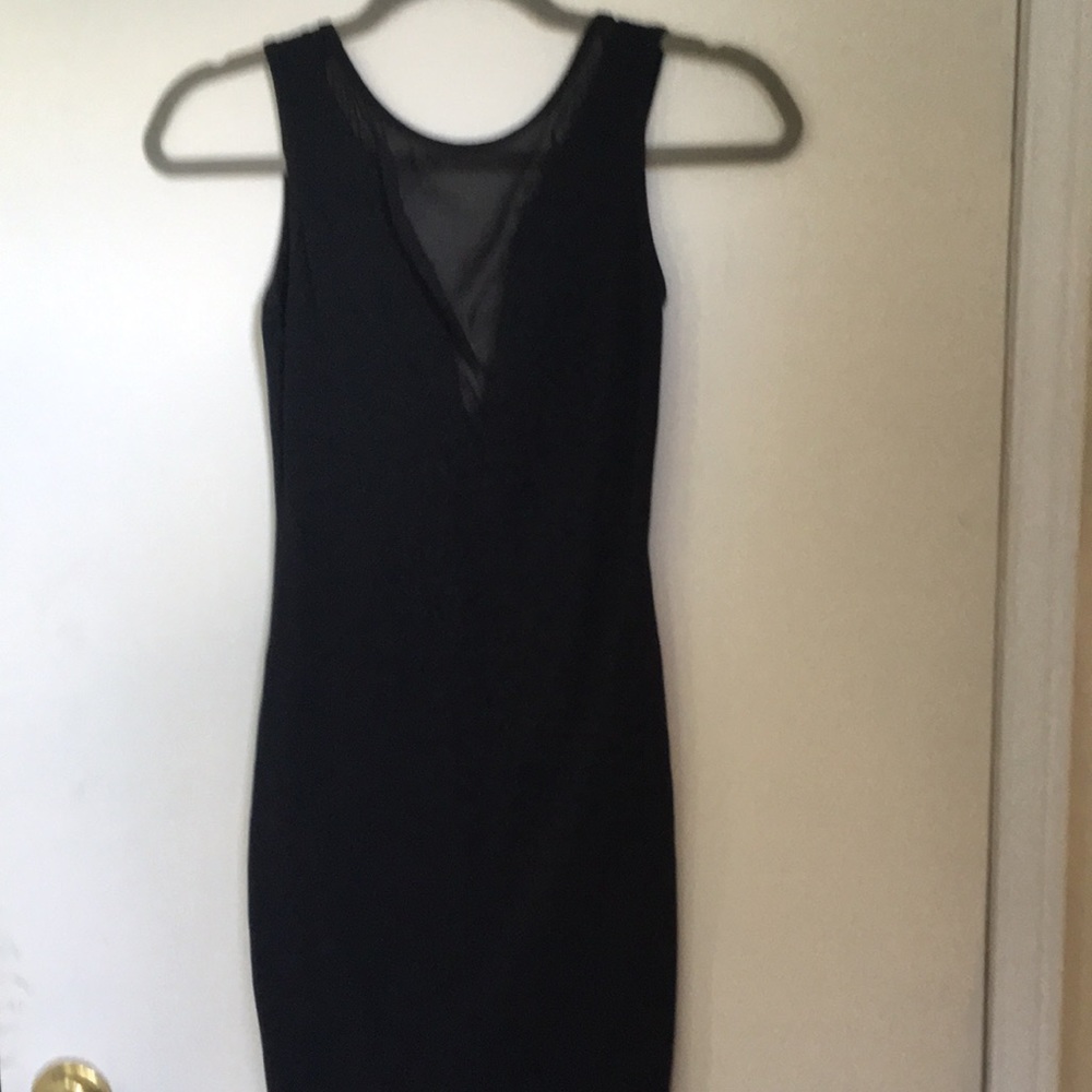 Basic black dress with plunge cleavage
